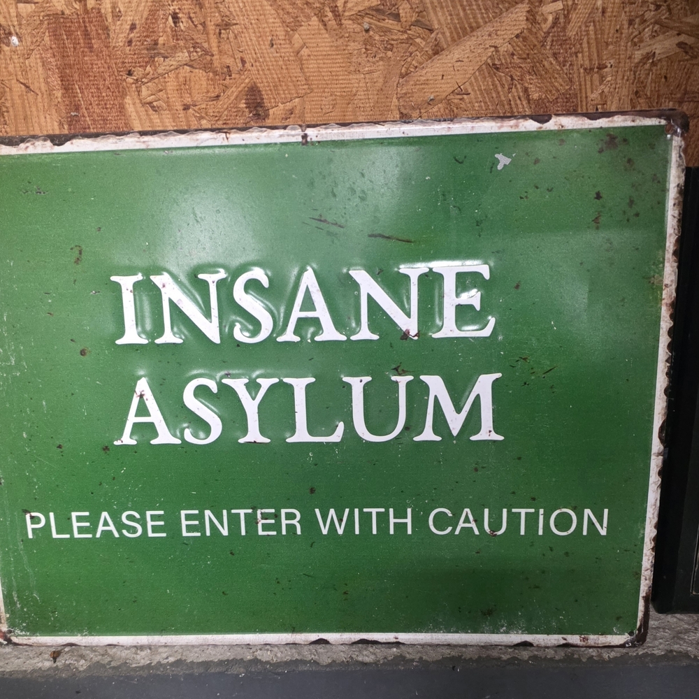 Green Metal Sign - Insane Asylum